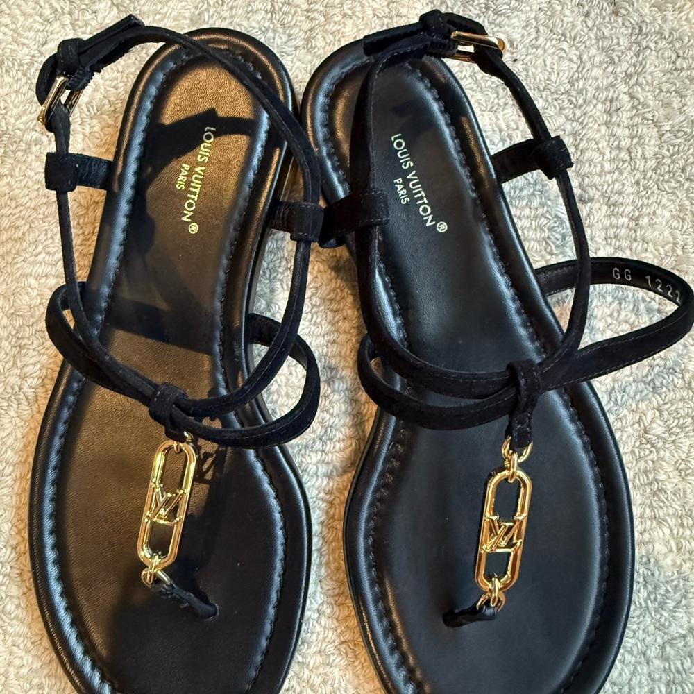 Louis Vuitton Elegant Black Sandals with Gold Charm